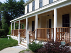 Custom farmer's porch & wooden porch railings installed in southwest MO